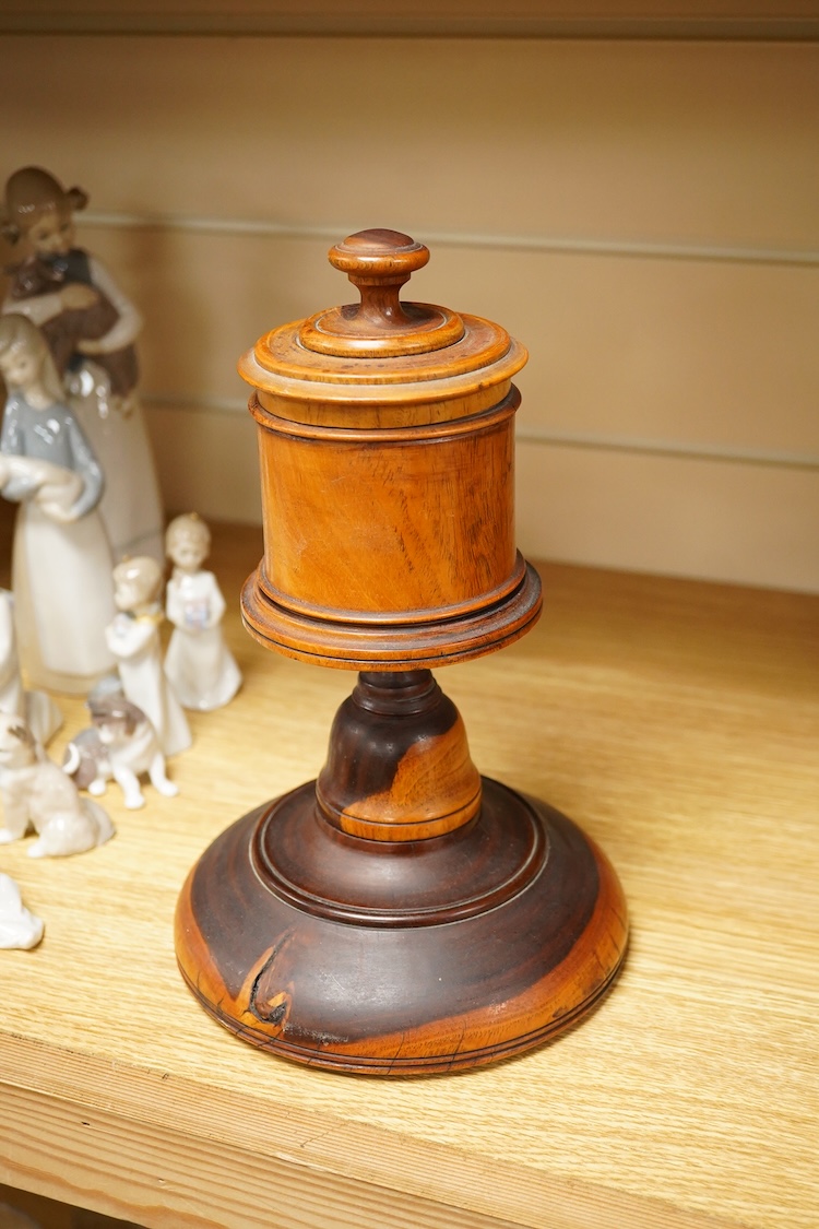 A 19th century treen lignum vitae pestle and mortar and turned cup and cover on stand- 25cm high